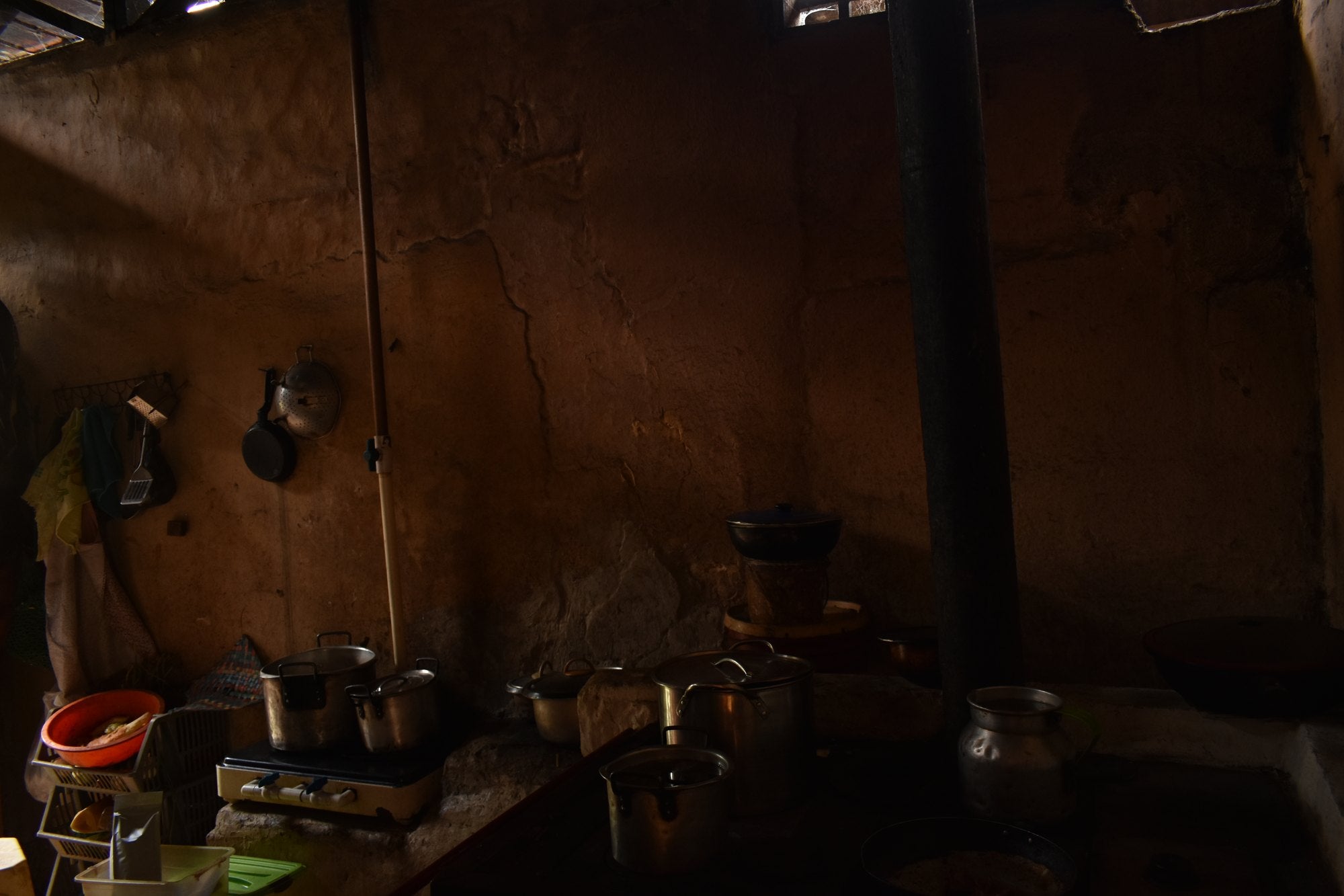 Hands sorting green coffee beans on a wooden table
